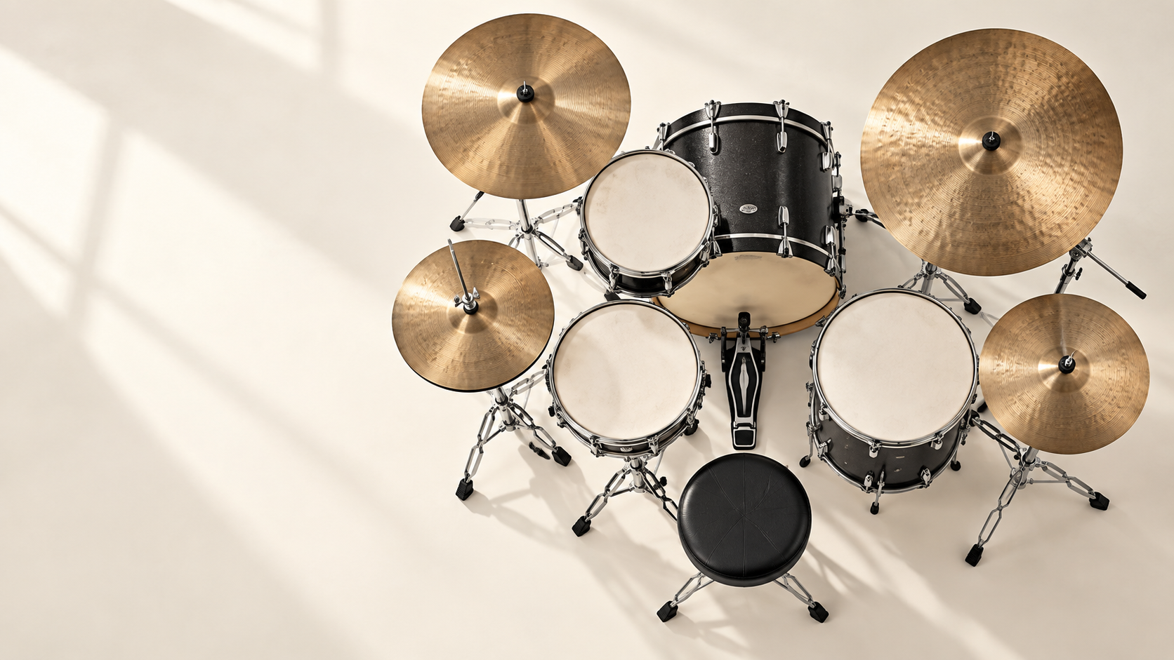 Overhead artistic view of a charcoal drum kit with bronze cymbals, inspired by Oido’s studio kit