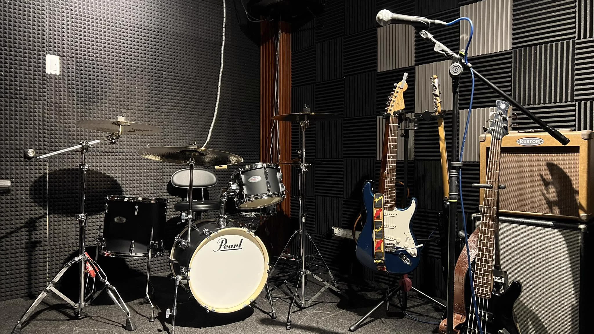 Drums and guitars in Oido’s acoustically treated rehearsal room